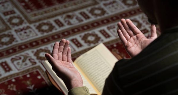 Muslim Man Is Reading The Koran